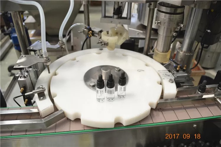 Mașină electronică de umplere cu lichid cu pompă peristaltică
